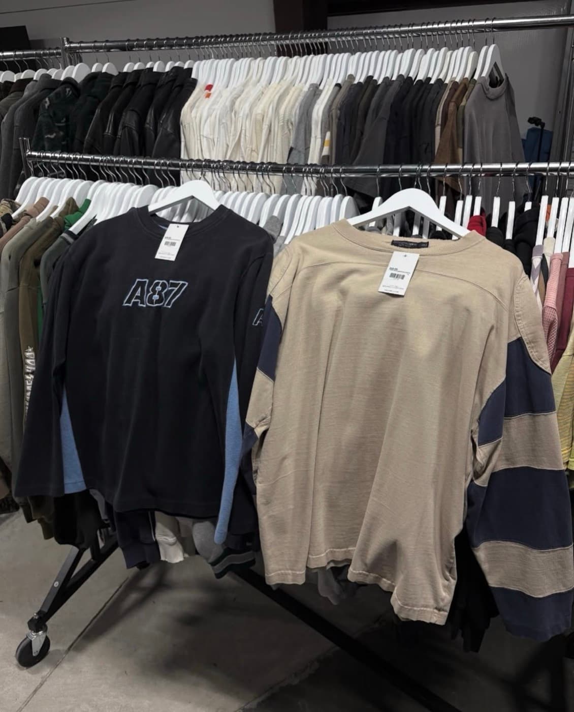 Tagged vintage inventory on the rack, ready to crosslist